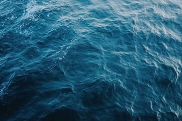 Fototapeta premium Abstract Blue Ocean Water Texture with Ripples and Waves Creates a Dynamic Background with a Deep Maritime Theme Perfect for Natural Graphic Designs