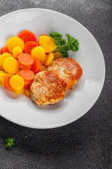 Vegetarian cutlet, boiled carrotbowl natural food vegetable dish organic fresh gourmet food background on the table rustic food top view copy space keto and paleo diet vegetarian and vegan food
