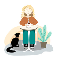 A woman with a cup of coffee is resting at a table. A black cat is sitting under the table.