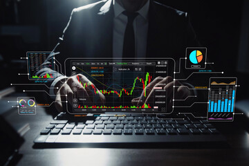 Business professional analyzing market trends using advanced technology and digital tools for financial trading in a modern office environment