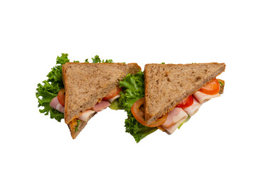 Two ham sandwiches with lettuce, tomato, and ham on whole-wheat bread are isolated on a white background.