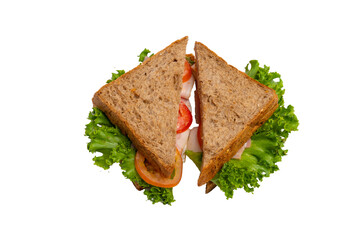 Two ham sandwiches with lettuce, tomato, and ham on whole-wheat bread are isolated on a white background.