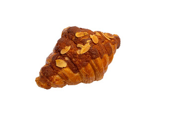 A flaky almond croissant, generously topped with sliced almonds, rests on a white background, showcasing its rich, golden-brown crust.
