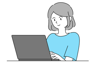 パソコンで何か調べている笑顔の若い女性