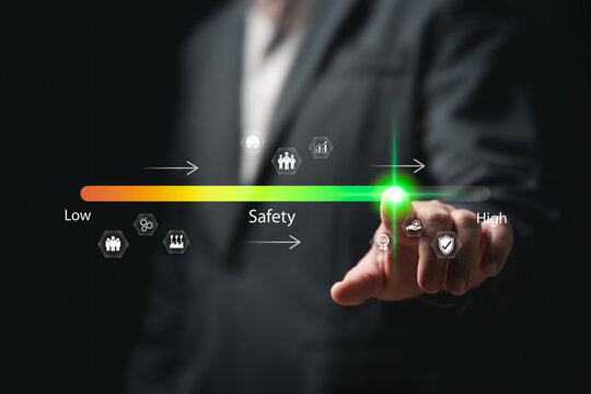 Safety, Risk Assessment concept, Businessman touch on safety level, Safety awareness comes first, Compliance, Security, Regulations standards in industry, Travel, Health protection, Personal security