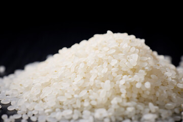Raw Japanese rice served on a black background