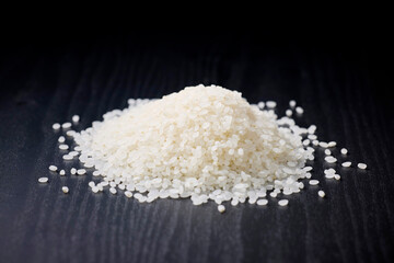 Raw Japanese rice served on a black background