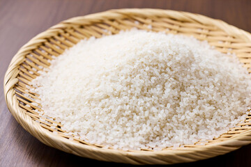 Raw Japanese rice in a bamboo sieve