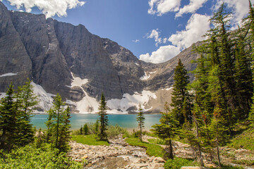 Glacier Mountain with teal green lake on summer day