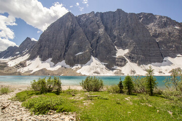 Glacier Mountain with teal green lake on summer day