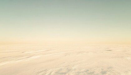 Snowy Beige Field under a Light Blue Sky a Minimalist Winter Landscape with a Tranquil Atmosphere and Horizon