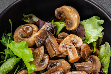 Mushrooms pickled champignon salad snack fresh delicious gourmet food background on the table rustic food top view copy space keto and paleo diet vegetarian and vegan food