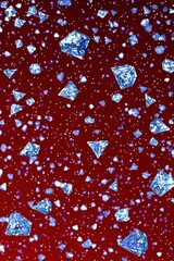 Sparkling Blue Crystals Floating on a Red Background in Motion