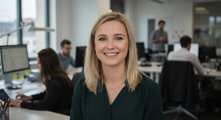 Obraz premium Confident Blonde Professional Smiling in Modern Office | Workplace Teamwork, Leadership & Employee Engagement Image