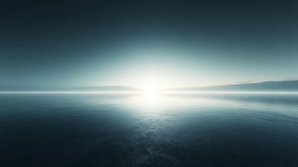Obraz premium Vast, tranquil expanse of water under a bright, hazy sunrise.