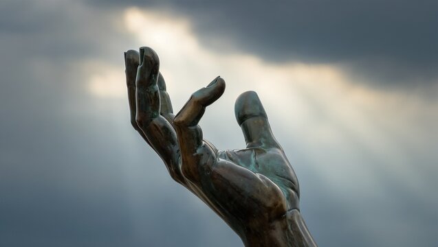 Symbol of liberation and hope rising against the backdrop of a stormy sky at dusk