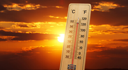 Heatwave Alert! Thermometer Soaring in Scorching Sunset Sky - Extreme Temperatures & Global Warming Visual