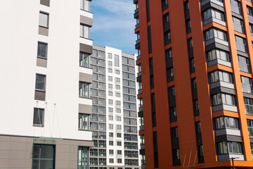 Modern apartment buildings on a sunny day with a blue sky. Facade of a modern apartment building