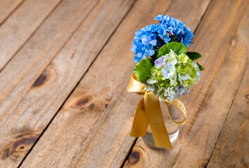 blue flowers on wooden background