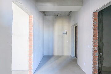rough repairs for self-finishing. interior decoration, bare walls of the room, stage of...