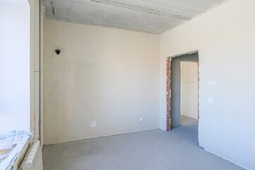rough repairs for self-finishing. interior decoration, bare walls of the room, stage of...