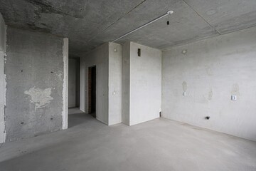 rough repairs for self-finishing. interior decoration, bare walls of the room, stage of...