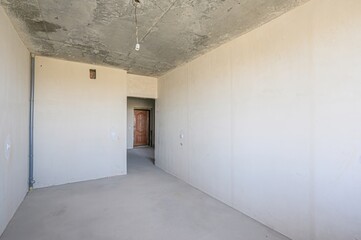 rough repairs for self-finishing. interior decoration, bare walls of the room, stage of construction. interior apartment room.