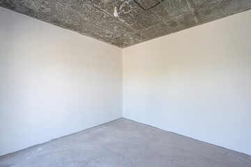 rough repairs for self-finishing. interior decoration, bare walls of the room, stage of...