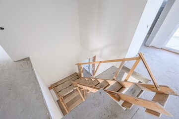 rough repairs for self-finishing. interior decoration, bare walls of the room, stage of...