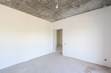 rough repairs for self-finishing. interior decoration, bare walls of the room, stage of...