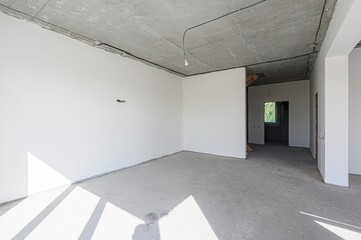 rough repairs for self-finishing. interior decoration, bare walls of the room, stage of...