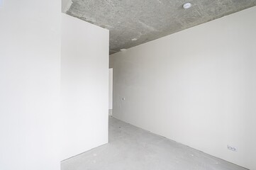 rough repairs for self-finishing. interior decoration, bare walls of the room, stage of...