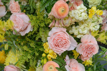 mostly pink roses and other florals outdoors