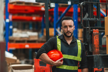 caucasian worker drive forklift using radio. adult employee driver lower lift to load shipping package on shelf at warehouse. caucasian supervisor drive cargo truck using transmitter do loading job