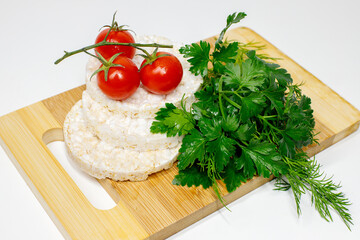 vegetables and rice cakes on a cutting board food