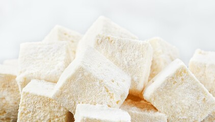 Horizontal Banner of Homemade Vanilla Marshmallows with Powdered Sugar and Copy Space.