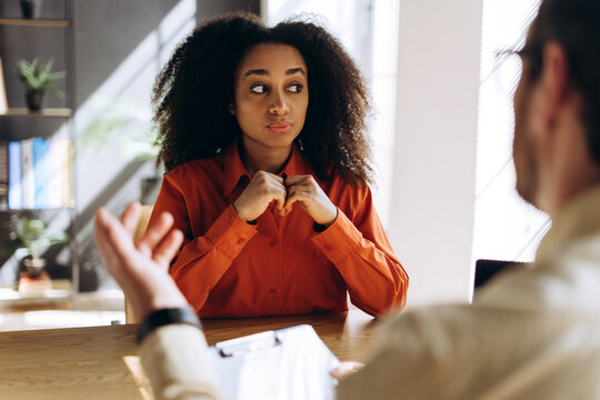 Young woman having a job interview with a recruiter in modern office