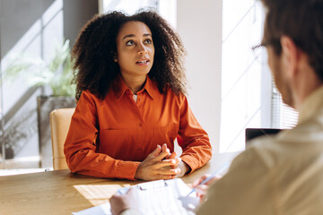 Young professional Latin woman having job interview with hr manager