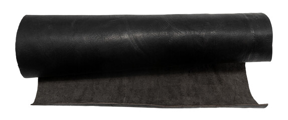 A rolled piece of black genuine leather on a white background. Piece of leather