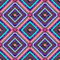 Seamless multicolor patchwork pattern with embroidered flowers and bright stripes. Variegated diamonds and floral squares. Beautiful print for a blanket or fabric in folk style.