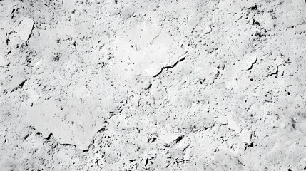 Photograph of rough, textured concrete with cracks and variations in tone.