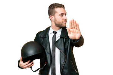 Business man with a motorcycle helmet over isolated chroma key background making stop gesture and disappointed