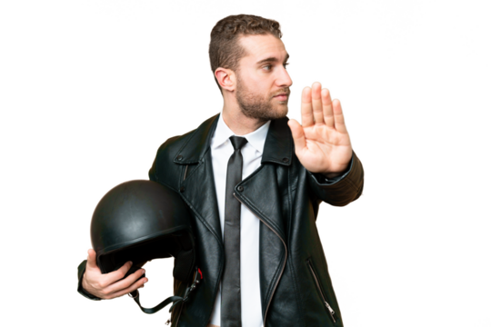 Business man with a motorcycle helmet over isolated chroma key background making stop gesture and disappointed