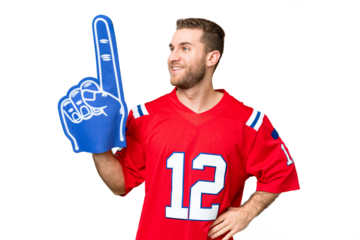 sports fan man over isolated chroma key background posing with arms at hip and smiling