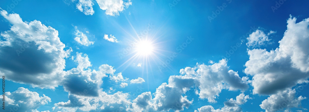 Aufkleber bright sun rays burst through fluffy cumulus clouds in a vibrant blue summer sky, creating a breatht