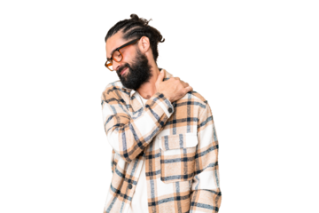 Young man with beard over isolated chroma key background suffering from pain in shoulder for having made an effort