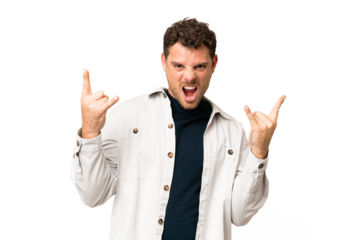 Brazilian man over isolated chroma key background making horn gesture