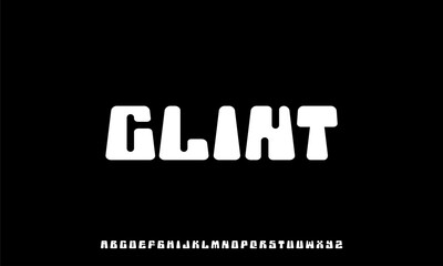 "Glint Font in Black Background: A modern typeface with bold, rounded letterforms that stand out elegantly on a dark backdrop."