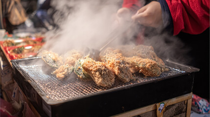 Process to Cooking Takoyaki on hot pan Famous food Osaka Japan street food. Making takoyaki filled with octopus pieces on a hot pan in the street food festival. Popular street food in Osaka