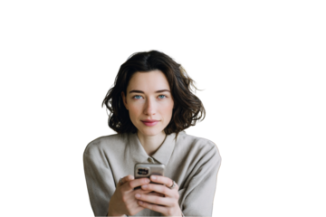 Portrait of a young woman with short brown hair holding a smartphone looking directly at the camera on transparent background face